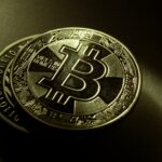 Detailed shot of a Bitcoin coin with a digital texture highlighting its cryptocurrency design.